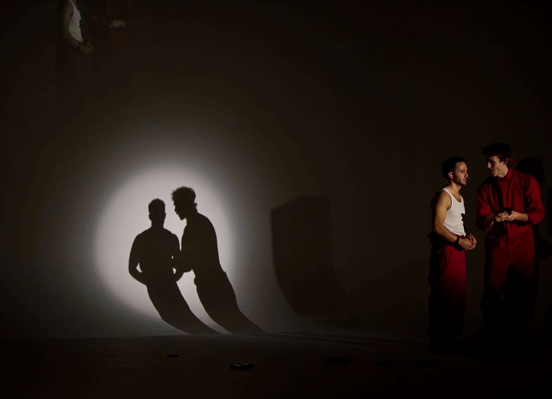 Two Filmshow performers and their shadows on stage